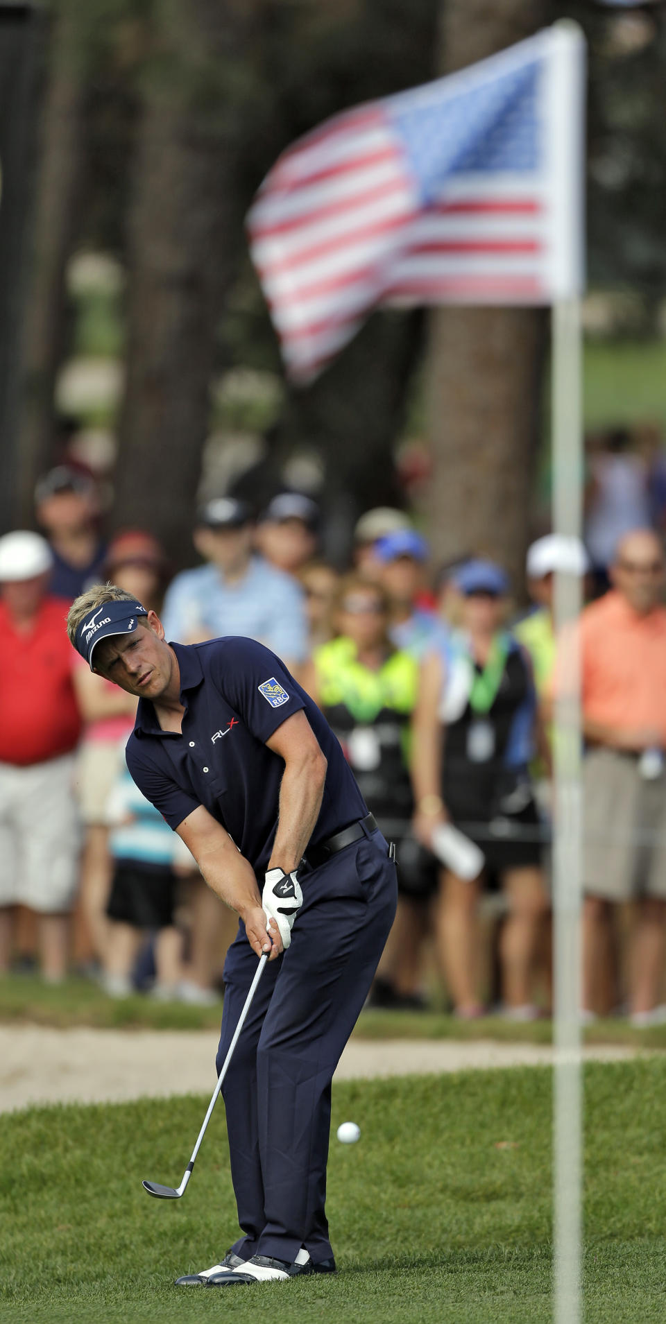 Luke Donald, of England, chips onto the 16th green during the final round of the Valspar Championship golf tournament at Innisbrook, Sunday, March 16, 2014, in Palm Harbor, Fla. Donald finished tied for fourth. (AP Photo/Chris O'Meara)