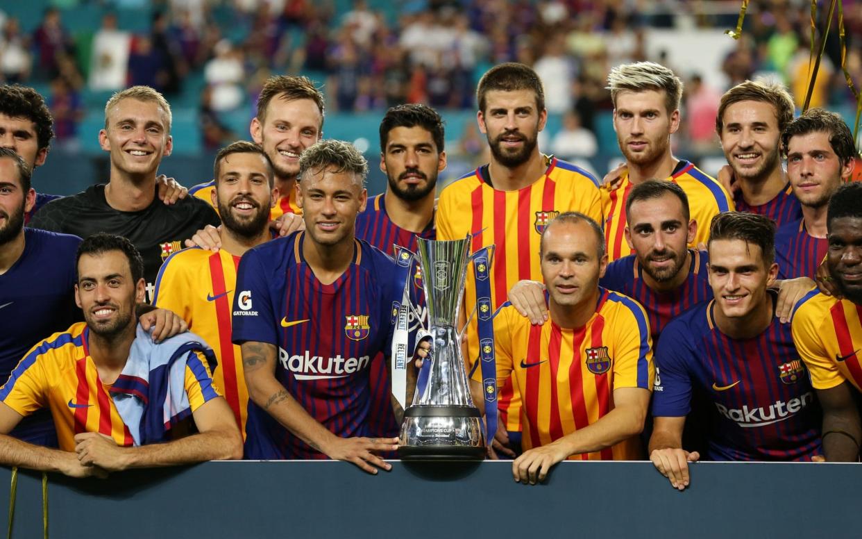 FC Barcelona celebrate winning the International Champions Cup by lifting the trophy during the International Champions Cup 2017 match between Real Madrid and FC Barcelona at Hard Rock Stadium on July 29, 2017 in Miami Gardens, Florida - Getty Images North America