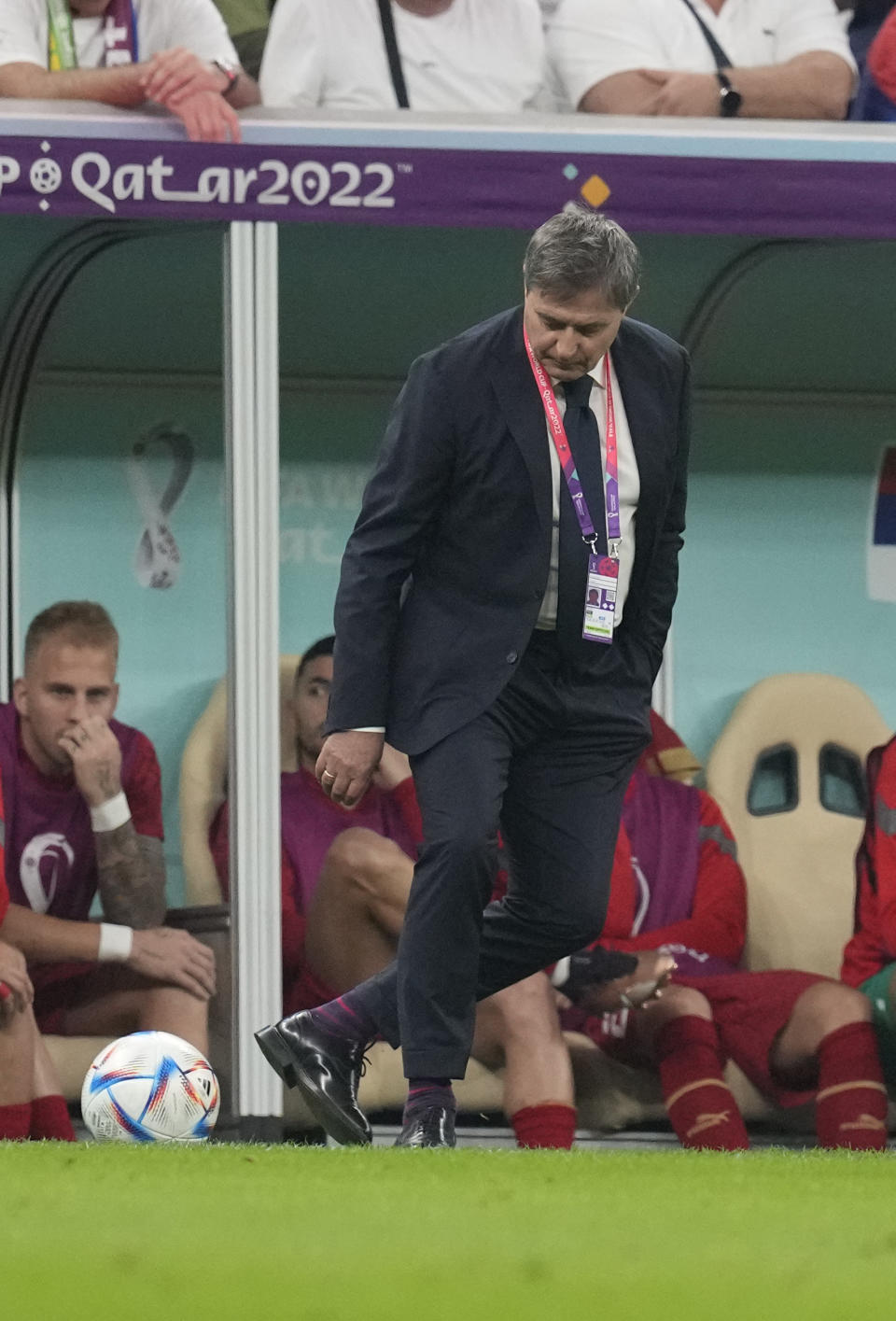 Serbia's head coach Dragan Stojkovic kicks the ball during the World Cup group G soccer match between Brazil and Serbia, at the Lusail Stadium in Lusail, Qatar, Thursday, Nov. 24, 2022. (AP Photo/Themba Hadebe)