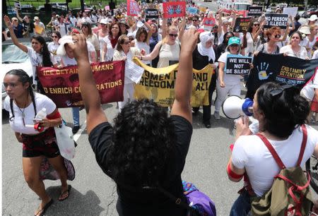 Hundreds of women and immigration activists march to the U.S. Capitol as part of a rally calling for "an end to family detention" and in opposition to the immigration policies of the Trump administration, in Washington, U.S., June 28, 2018. REUTERS/Jonathan Ernst