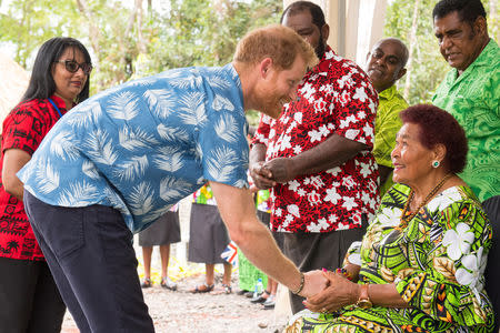 Britain's Prince Harry meets Litiana Vulaca, 86, who served tea to Queen Elizabeth during her visit in 1953, at a dedication of the Colo-i-Suva forest to the Queen's Commonwealth Canopy in Suva, Fiji, October 24, 2018. Dominic Lipinski/Pool via REUTERS