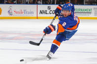 UNIONDALE, NY - FEBRUARY 12: Mark Streit #2 of the New York Islanders shoots the puck against the Florida Panthers during their game on February 12, 2012 at the Nassau Coliseum in Uniondale, New York. (Photo by Al Bello/Getty Images)