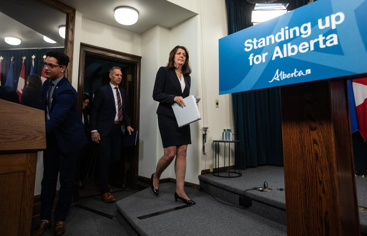 Alberta Premier Danielle Smith walks to the podium to speak on invoking her government’s Sovereignty Act over federal clean energy regulations, in Edmonton on Nov. 27, 2023. (Jason Franson/The Canadian Press - image credit)