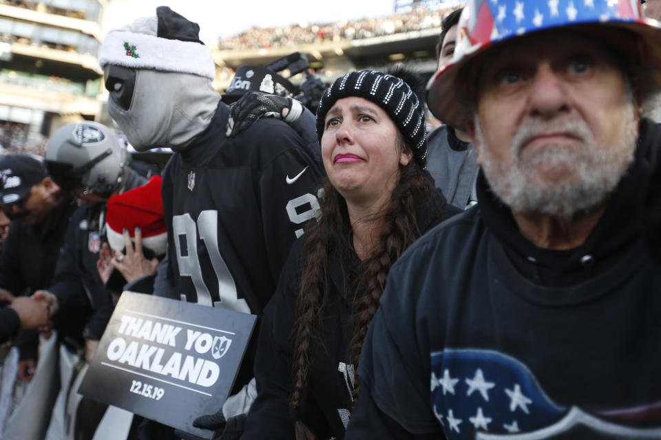 Oakland Raiders fans in "The Black Hole" watch their team walk off the field at the end of an NFL football game against the Jacksonville Jaguars n Oakland, Calif., Sunday, Dec. 15, 2019. (AP Photo/D. Ross Cameron)