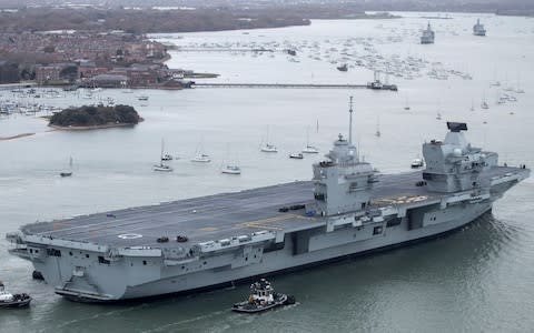 At 280m (918ft) long and with an estimated half-a-century working life, HMS Queen Elizabeth is the biggest carrier ever built by the UK - Credit: Matt Cardy /Getty