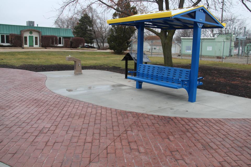 The newly renovated Rotary Plaza in Adel features a brick-stamped concrete path and new benches.
