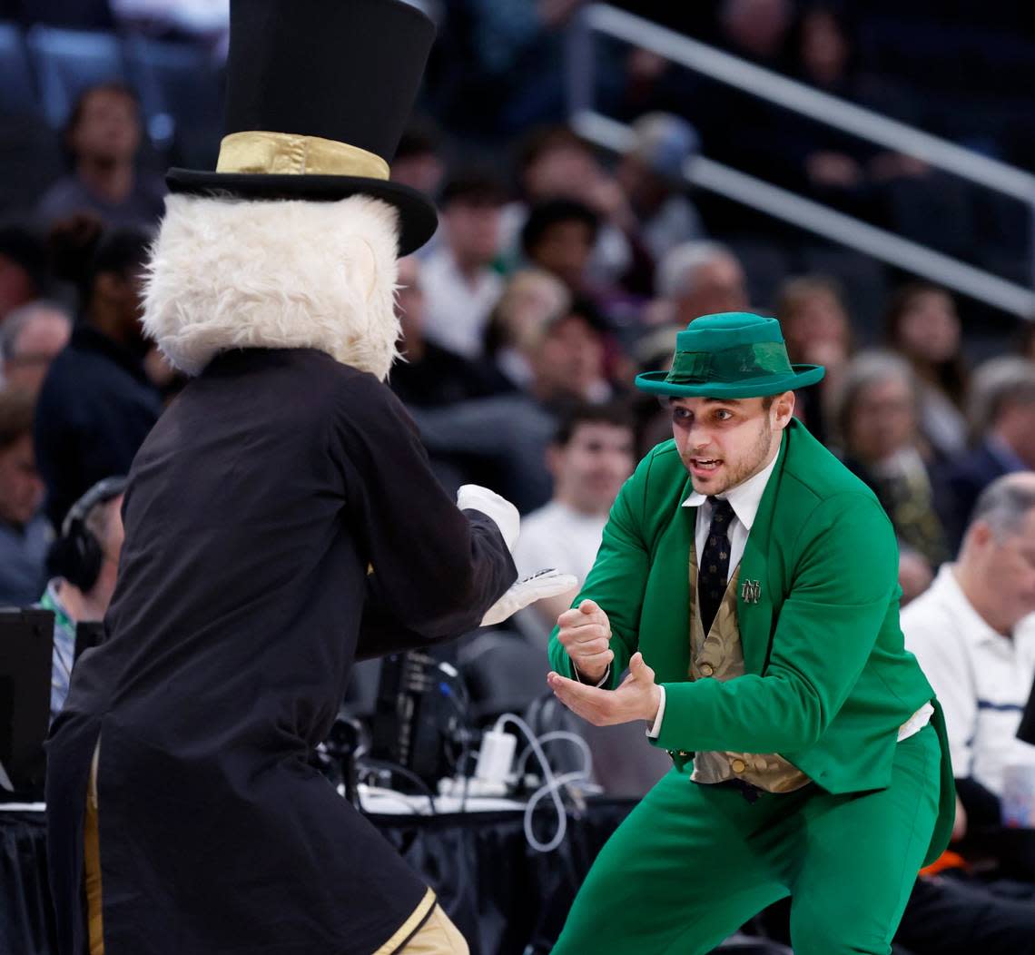The Notre Dame Leprechaun and the Wake Forest Demon Deacon play rock paper scissors during the second half of Wake Forest’s 72-59 victory over Notre Dame in the second round of the 2024 ACC Men’s Basketball Tournament at Capital One Arena in Washington, D.C., Wednesday, March 13, 2024.