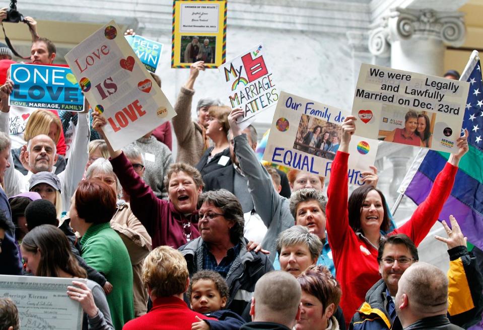 Supporters of gay marriage fill the rotunda as they gather to rally at the Utah State Capitol and deliver over 58,000 petition signatures in support of gay marriage to Utah Governor Gary Herbert Jan. 10, 2014, in Salt Lake City. (AP Photo/Steve C. Wilson)