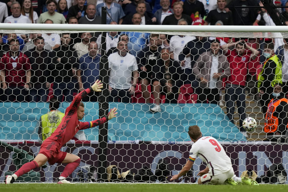 England's Harry Kane, right, scores his side's second goal during the Euro 2020 soccer championship round of 16 match between England and Germany at Wembley stadium in London, Tuesday, June 29, 2021. (AP Photo/Frank Augstein, Pool)