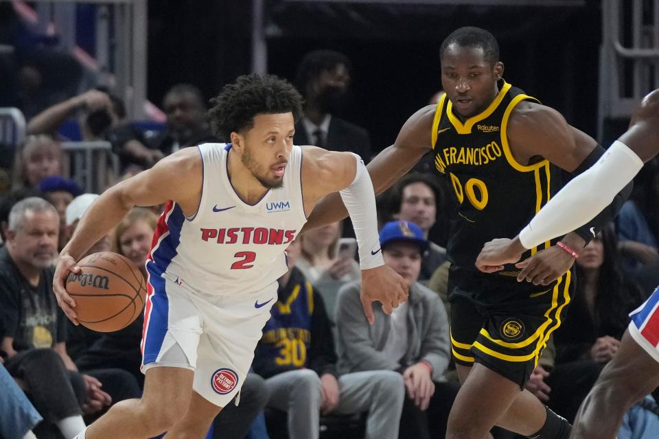 Detroit Pistons guard Cade Cunningham drives to the basket against Golden State Warriors forward Jonathan Kuminga during the first half at Chase Center in San Francisco on Friday, Jan. 5, 2024.