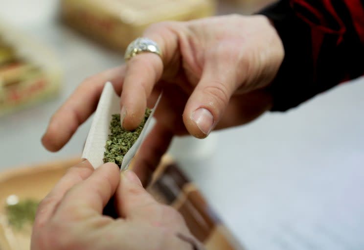 A participant practices rolling a joint at the Cannabis Carnivalus 4/20 event in Seattle, Washington, U.S. on April 20, 2014. (Photo: Jason Redmond/Reuters)