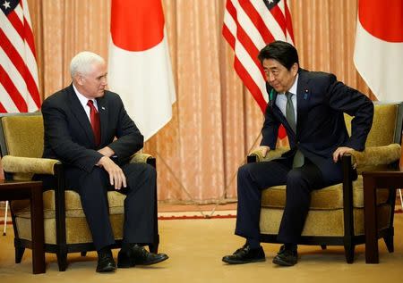 U.S. Vice President Mike Pence (L) meets with Japan's Prime Minister Shinzo Abe at Abe's official residence in Tokyo, Japan April 18, 2017. REUTERS/Kim Kyung-Hoon