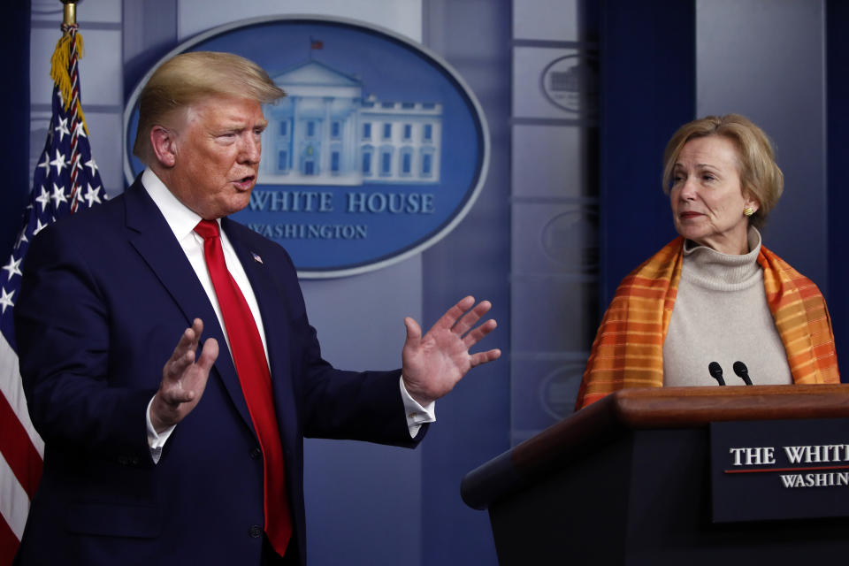 President Donald Trump speaks about the coronavirus in the James Brady Press Briefing Room of the White House, Friday, April 3, 2020, in Washington, as Dr. Deborah Birx, White House coronavirus response coordinator, listens. (AP Photo/Alex Brandon)