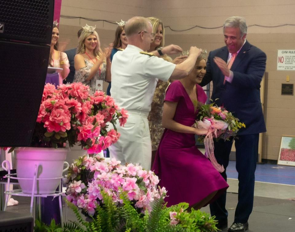 Wilmington mayor Bill Saffo, right, helps with the crowning of Carli Batson as Azalea Festival Queen during the queen's coronation on Wednesday.