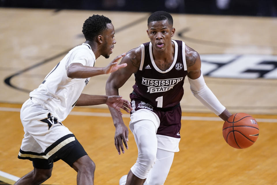 Mississippi State guard Iverson Molinar (1) is guarded by Vanderbilt guard Trey Thomas, left, in the second half of an NCAA college basketball game Saturday, Jan. 9, 2021, in Nashville, Tenn. (AP Photo/Mark Humphrey)