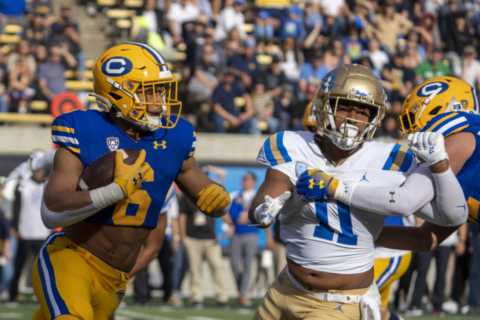 November 25, 2022; Berkeley, California, USA; California Golden Bears running back Jaydn Ott (6) runs the football against <a class="link " href="https://sports.yahoo.com/ncaaw/teams/ucla/" data-i13n="sec:content-canvas;subsec:anchor_text;elm:context_link" data-ylk="slk:UCLA Bruins;sec:content-canvas;subsec:anchor_text;elm:context_link;itc:0">UCLA Bruins</a> defensive lineman Gabriel Murphy (11) during the first quarter at California Memorial Stadium. Mandatory Credit: Kyle Terada-USA TODAY Sports