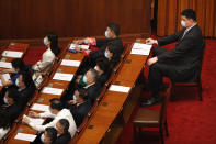 Former NBA basketball player Yao Ming, right, and other delegates wear face masks to protect against the new coronavirus as they attend the opening session of the Chinese People's Political Consultative Conference (CPPCC) at the Great Hall of the People in Beijing, Thursday, May 21, 2020. (AP Photo/Andy Wong, Pool)