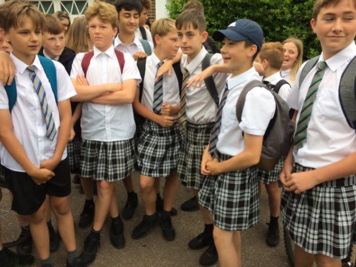<i>50 Exeter schoolboys have worn skirts in a protest against their school’s uniform policy [Photo: Twitter/SimonHallNews]</i>