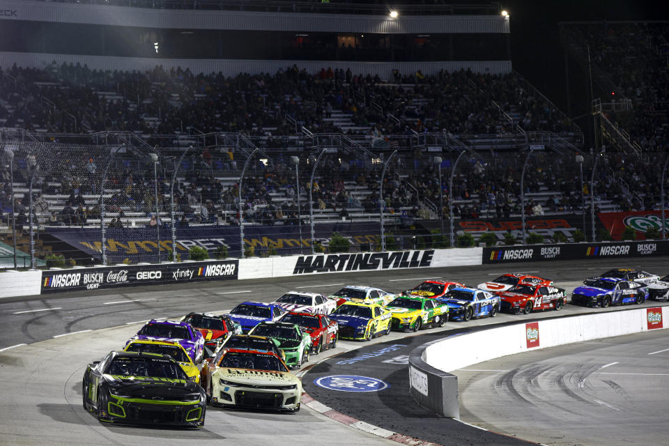 MARTINSVILLE, VIRGINIA - APRIL 09: William Byron, driver of the #24 RaptorTough.com Chevrolet, and Chase Elliott, driver of the #9 LLumar Chevrolet, lead the field during the NASCAR Cup Series Blue-Emu Maximum Pain Relief 400 at Martinsville Speedway on April 09, 2022 in Martinsville, Virginia. (Photo by Jared C. Tilton/Getty Images)