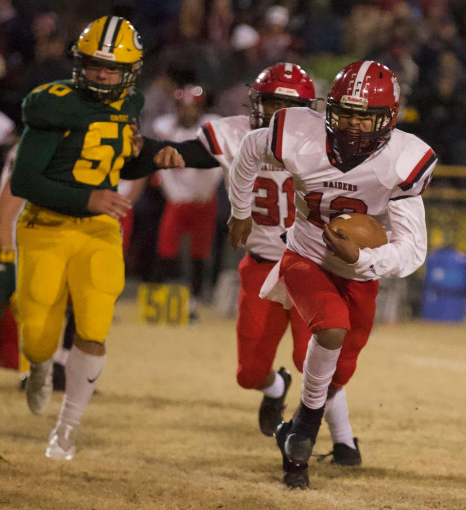 South Point quarterback Elijah Phifer runs upfield in the second half of Friday's matchup with Crest.