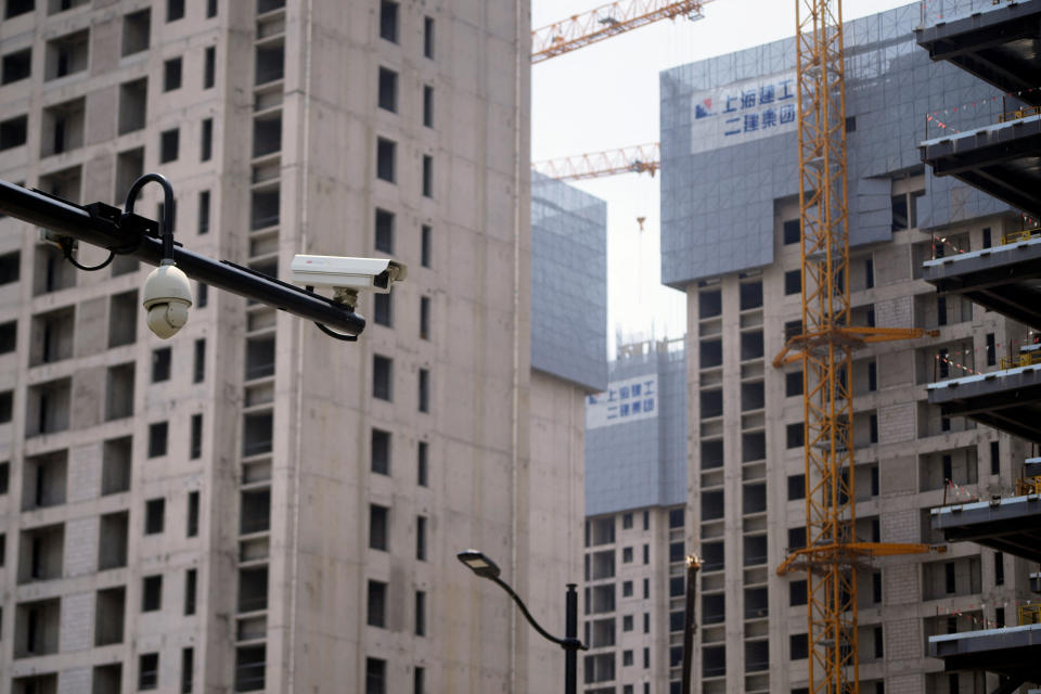 Surveillance cameras are seen near residential buildings under construction in Shanghai, China July 20, 2022. REUTERS/Aly Song