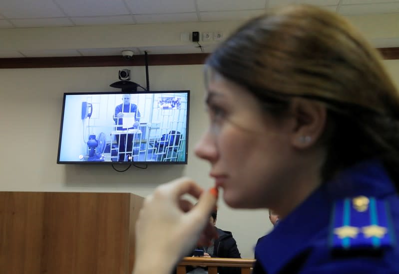 Former U.S. marine Whelan is seen on a screen via a video link during a court hearing in Moscow