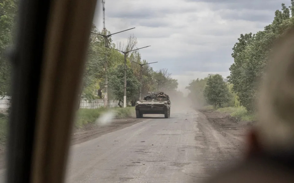 A BMP-2 drives along a road in the Bakhmut area - Heathcliff O'Malley