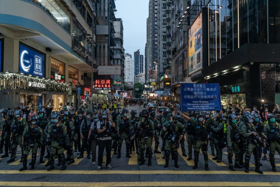 Riot police put up an warning flag during an anti-government protest on September 6, 2020 in Hong Kong, China.