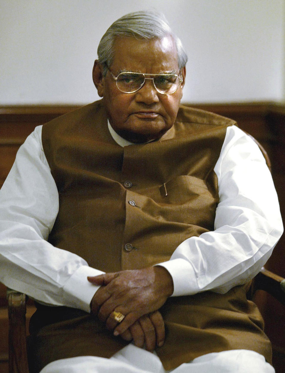 FILE - In this May 14, 2004 file photo, outgoing Indian Prime Minister Atal Bihari Vajpayee attends a meeting with members of his Bharatiya Janata Party at the Prime Minister's residence in New Delhi, India. Former prime minister Vajpayee, who pursued both nuclear weapons and peace talks with Pakistan, died Thursday, Aug. 16, 2018, at age 93. (AP Photo/Elizabeth Dalziel, File)