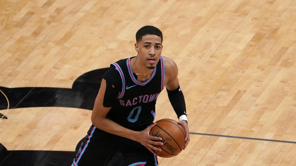 Sacramento Kings guard Tyrese Haliburton looks to pass during the second half of an NBA basketball game against the Miami Heat in Sacramento, Calif., Thursday, Feb. 18, 2021. 