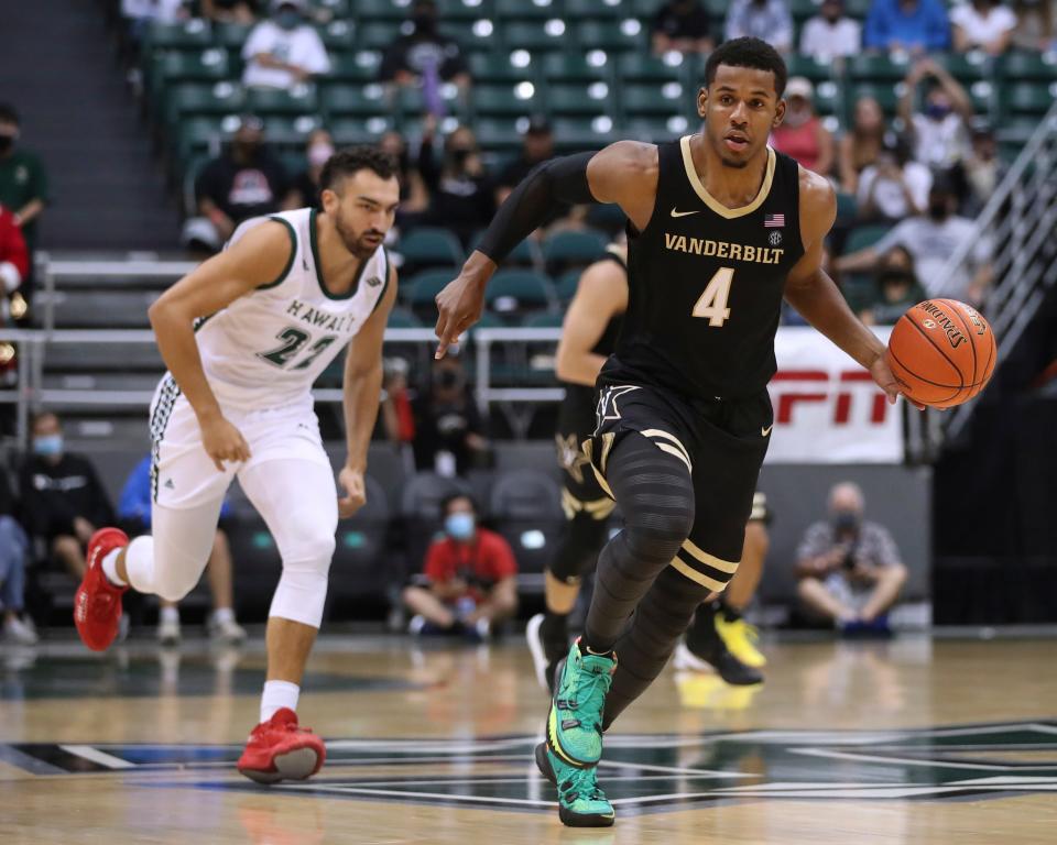 Vanderbilt forward Jordan Wright (4) brings the ball up during the first half of the team's NCAA college basketball game against Hawaii on Wednesday, Dec. 22, 2021, in Honolulu. (AP Photo/Marco Garcia)