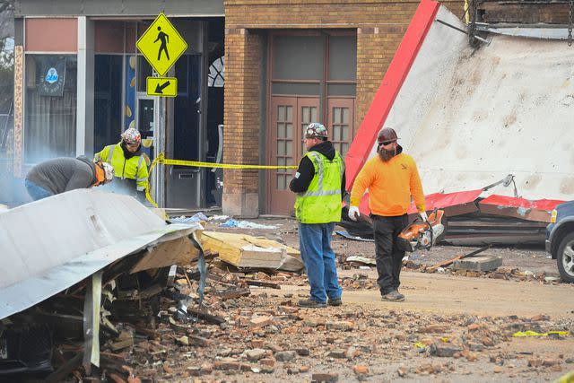 MATT MARTON/EPA-EFE/Shutterstock Workers cleaning up damage at the Apollo Theatre