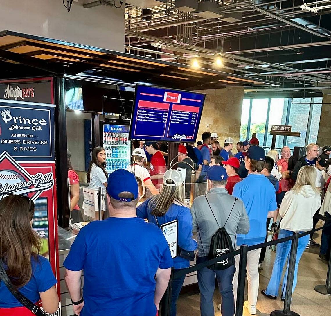 Long lines at a Prince Lebanese Grill booth at a Texas Rangers game in Globe Life Field.