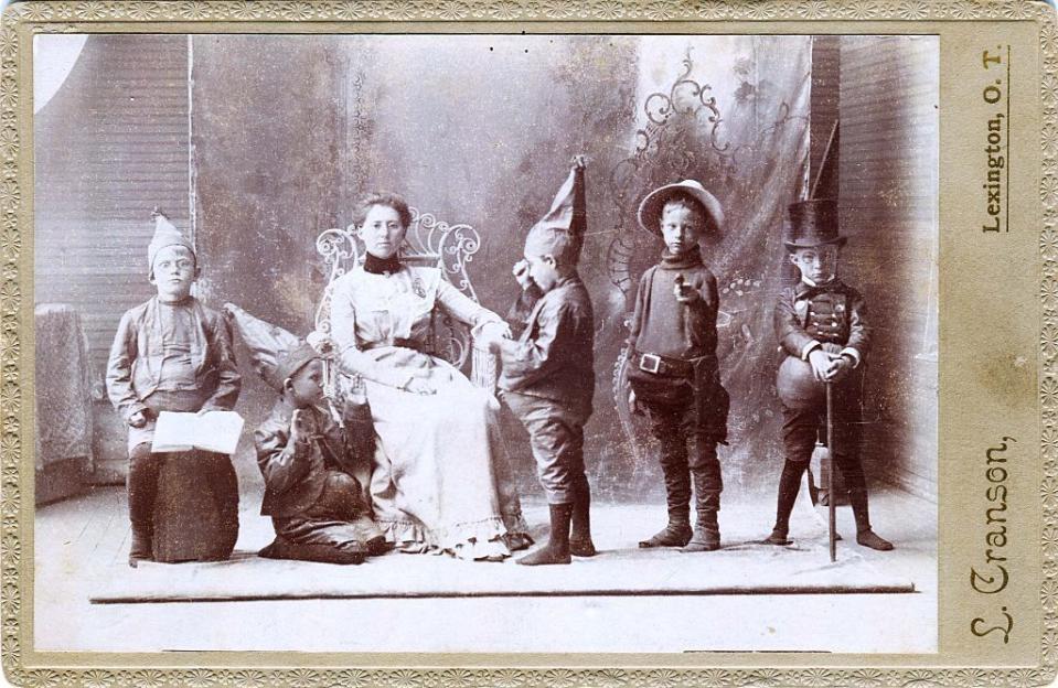 <p>A woman and four boys in full Halloween costume, in Lexington, Oklahoma circa 1890. </p>