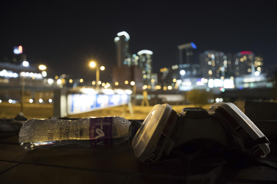 In this Thursday, Nov. 21, 2019, photo, debris are left at the Hong Kong Polytechnic University in Hong Kong. Most of the protesters who took over the university have left following clashes with police, but an unknown number have remained inside, hoping somehow to avoid arrest. (AP Photo/Vincent Thian)