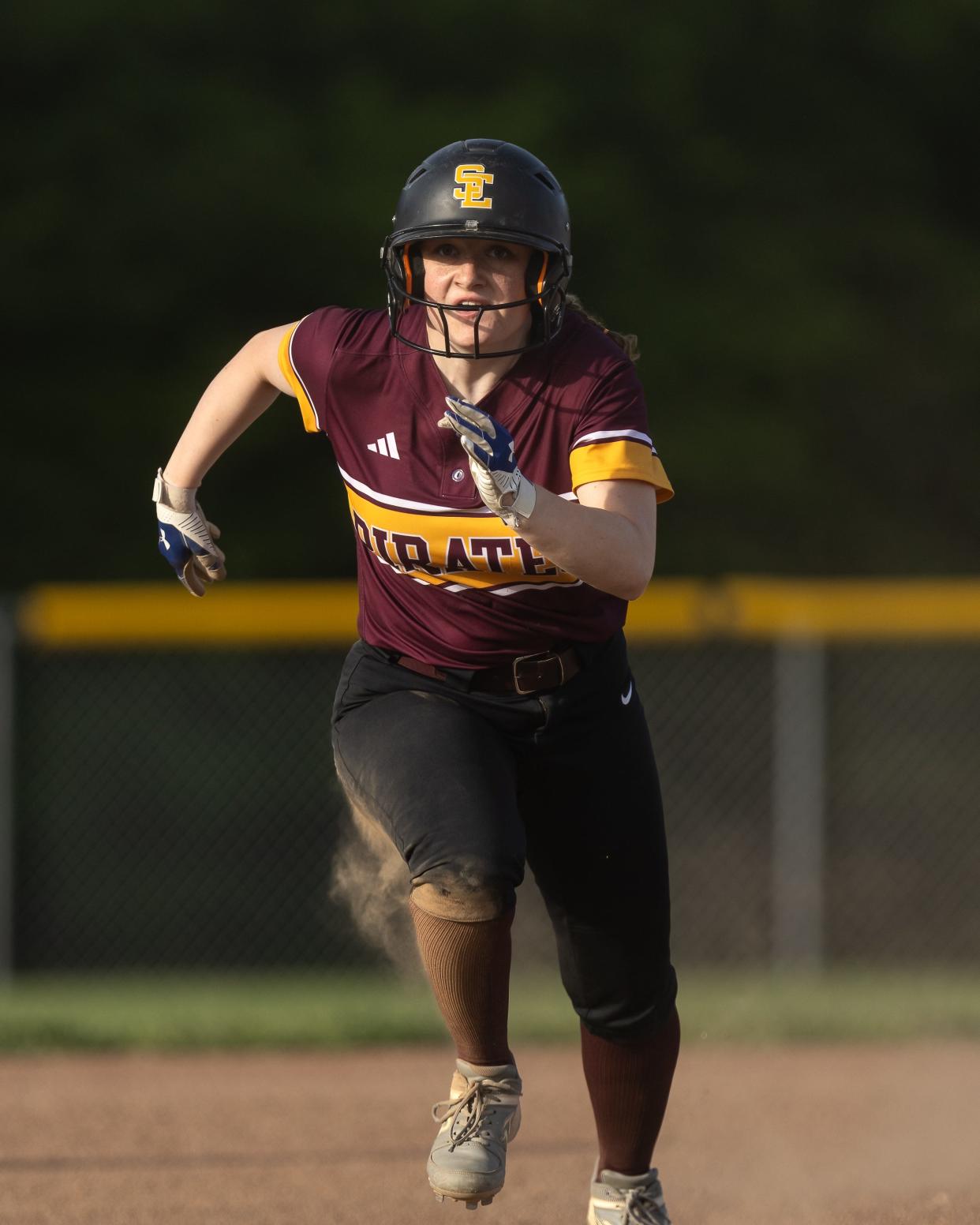 Southeast’s Addie Goldstein charges to steal third base during Wednesday night’s game against the Garfield G-Men in Garrettsville.
