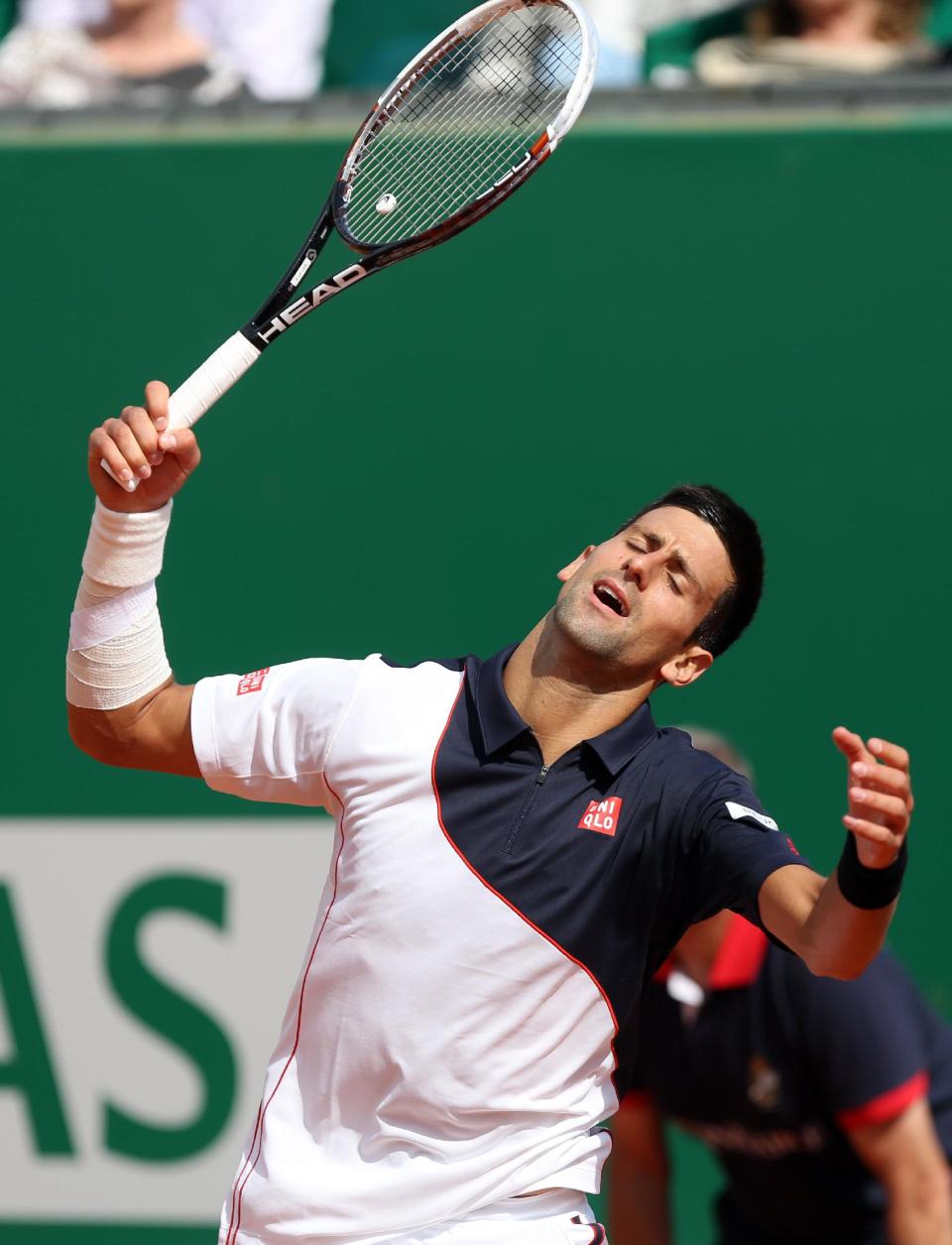 Novak Djokovic of Serbia reacts after losing a point against Roger Federer of Switzerland, during their semifinal match of the Monte Carlo Tennis Masters tournament, in Monaco, Saturday, April, 19, 2014. Federer won 7-6, 6-2. (AP Photo/Claude Paris)