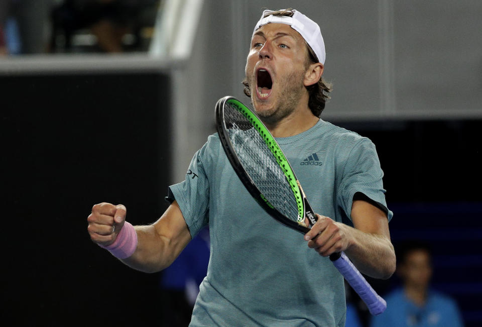 France's Lucas Pouille celebrates after defeating Australia's Alexei Popyrin in their third round match at the Australian Open tennis championships in Melbourne, Australia, Sunday, Jan. 20, 2019. (AP Photo/Kin Cheung)