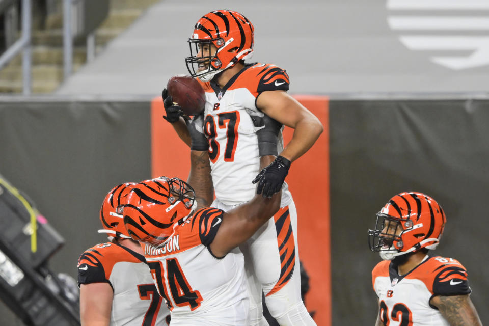 Cincinnati Bengals tight end C.J. Uzomah (87) celebrates with teammates after touchdown during the first half of the team's NFL football game against the Cleveland Browns, Thursday, Sept. 17, 2020, in Cleveland. (AP Photo/David Richard)