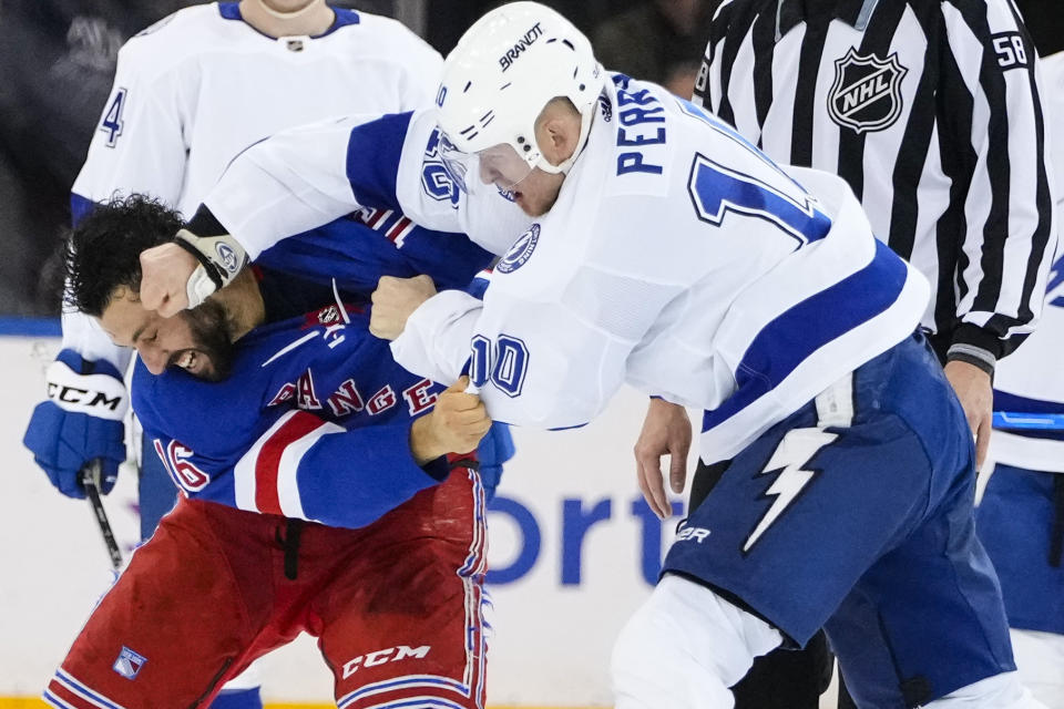Tampa Bay Lightning's Corey Perry (10) punches New York Rangers' Vincent Trocheck (16) during the second period of an NHL hockey game Wednesday, April 5, 2023, in New York. (AP Photo/Frank Franklin II)