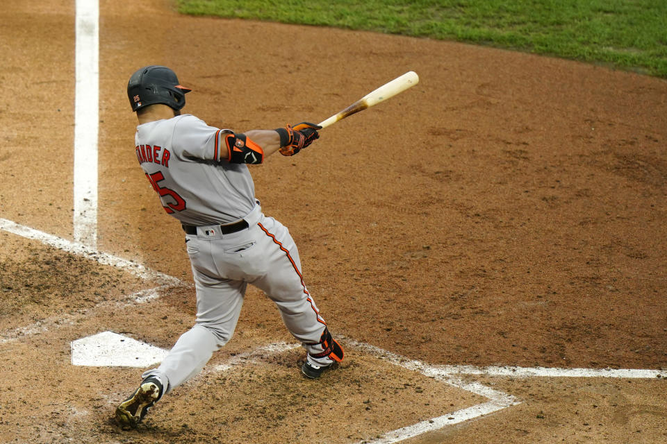 Baltimore Orioles' Anthony Santander follows through after hitting a three-run double off Philadelphia Phillies pitcher Jake Arrieta during the fifth inning of a baseball game, Thursday, Aug. 13, 2020, in Philadelphia. (AP Photo/Matt Slocum)