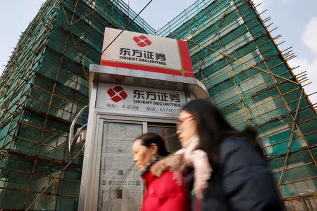 Logos of Orient Securities are seen near a branch of the company in Shanghai, China, January 26, 2017. REUTERS/Aly Song