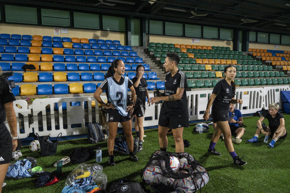 Members of the women's seven-a-side team react during training in Happy Valley ahead of the Gay Games in Hong Kong, Tuesday, Oct. 31, 2023. Set to launch on Friday, Nov. 3, 2023, the first Gay Games in Asia are fostering hopes for wider LGBTQ+ inclusion in the Asian financial hub. (AP Photo/Chan Long Hei)