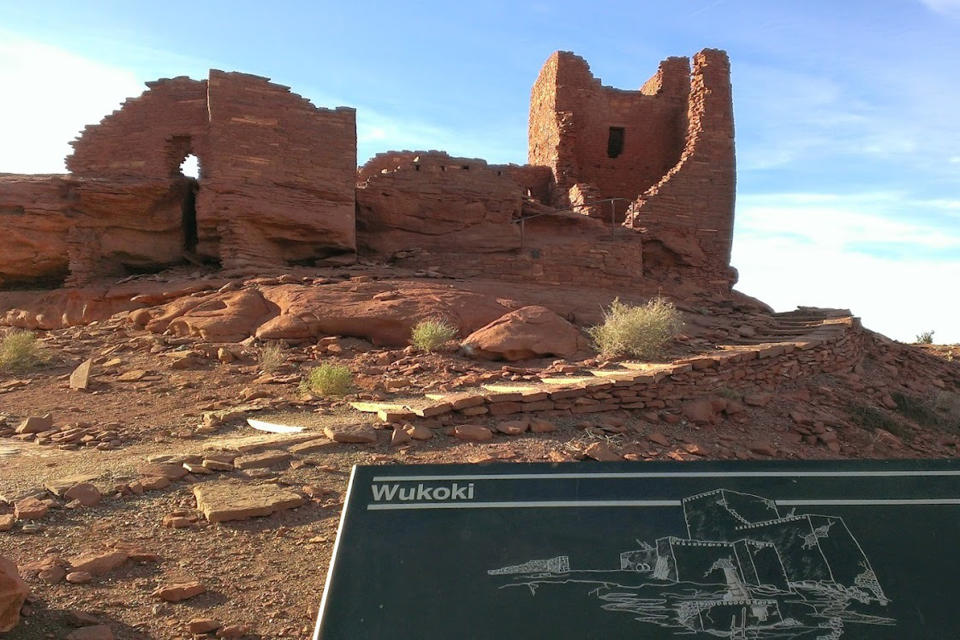 This photo shows the remains of a multilevel stone dwelling at Wupatki National Monument outside Flagstaff, Arizona, on Feb. 17, 2014. The monument has been evacuated twice during spring 2022 because of wildfires. (AP Photo/Felicia Fonseca)