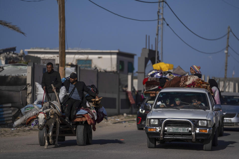 Palestinians who flee from Khan Younis from Israeli ground and air offensive on the Gaza Strip arrive in Rafah, southern Gaza, Monday, Jan. 22, 2024. (AP Photo/Fatima Shbair)