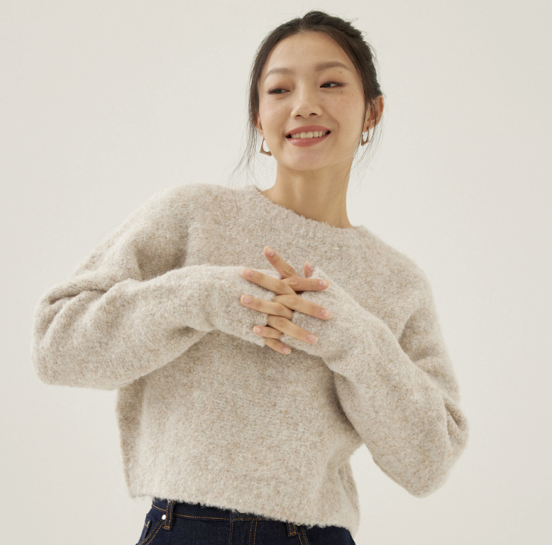 A model wearing the Jennie Relaxed Fuzzy Knit Sweater. (PHOTO: Love, Bonito)