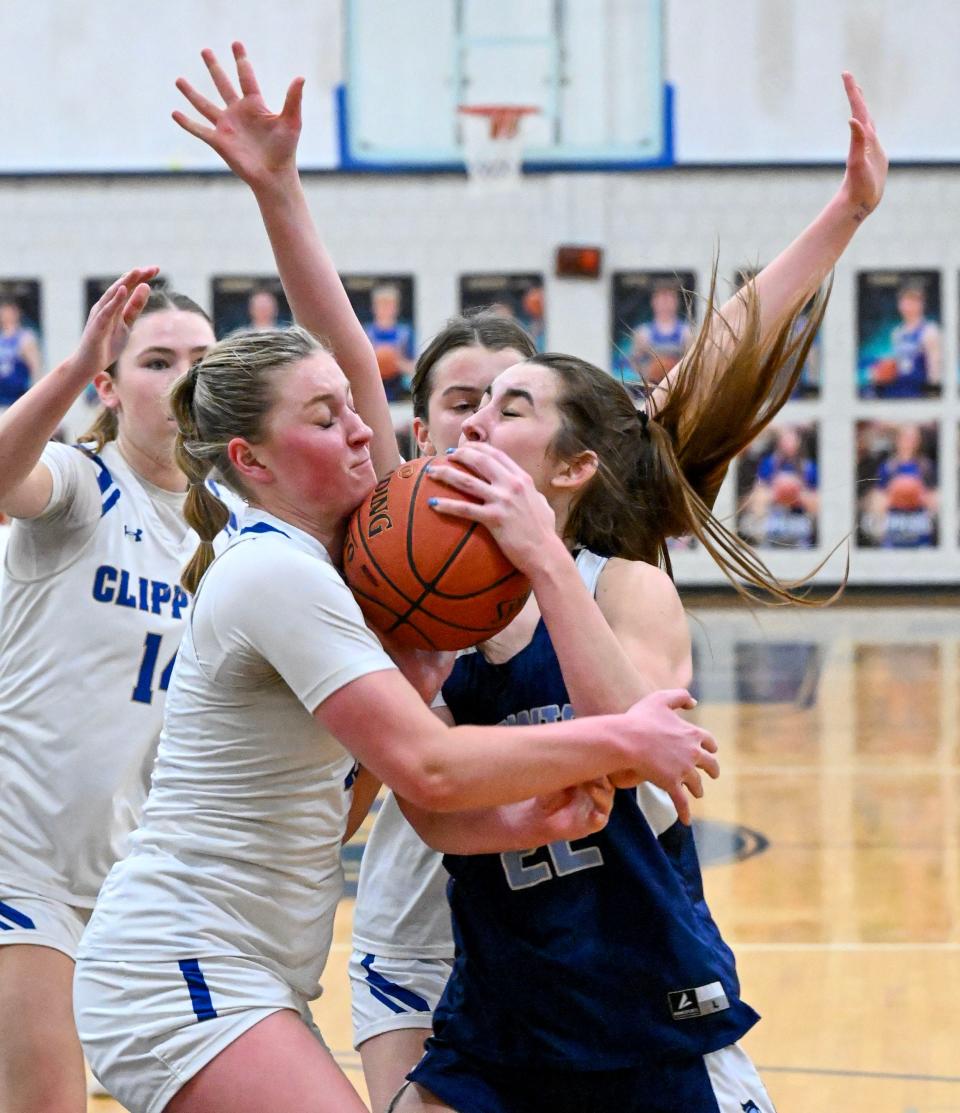 NORWELL 03/08/24 Reagan Dowd of Norwell stops a drive to the hoop by Madi Lawrence of Sandwich in the Div. 3 elite eight girls basketball
Ron Schloerb/Cape Cod Times