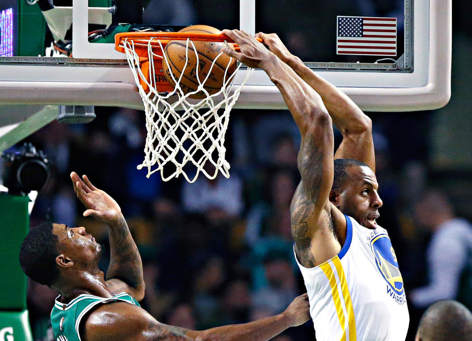 <p>Golden State Warriors’ Andre Iguodala, second from right, does a reverse dunk in front of Boston Celtics’ Marcus Smart, second from left, during the second quarter of an NBA basketball game in Boston, Thursday, Nov. 16, 2017. (AP Photo/Michael Dwyer) </p>