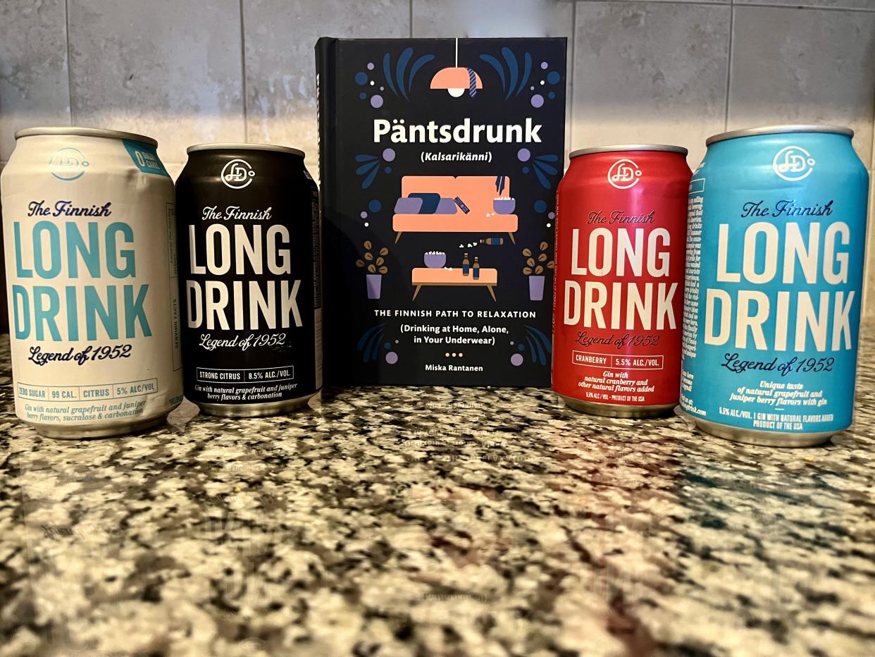 four cans of finnish long drink with Pantsdrunk book