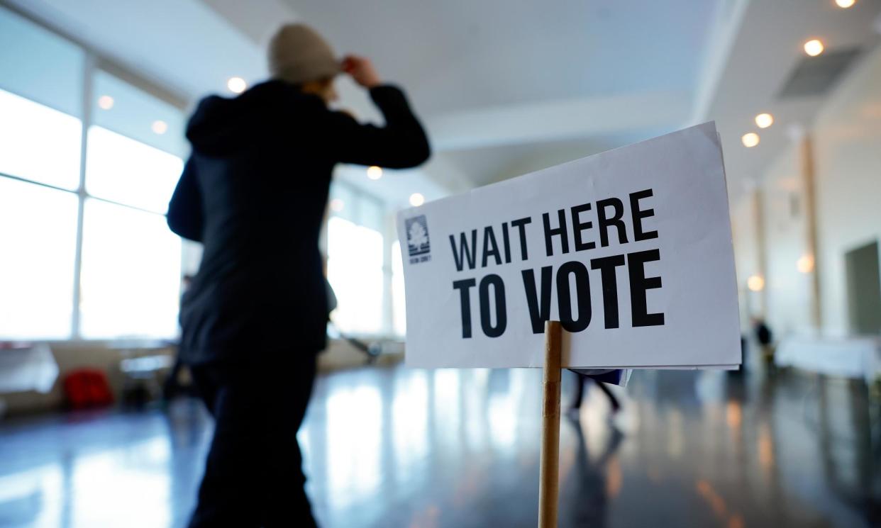 <span>A voter prepares to cast their ballot in the presidential primary election in Atlanta, Georgia, on 12 March.</span><span>Photograph: Alex Slitz/EPA</span>